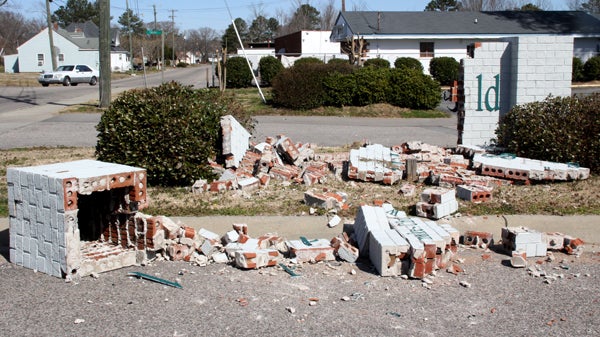 Brick and mortar litter the entrance to the Roanoke-Chowan News-Herald parking lot as a result of a weekend accident. Staff Photo by Cal Bryant