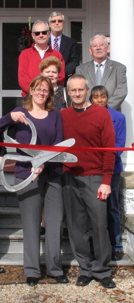 Teresa and Tim Flanagan cut the ceremonial ribbon to formally open their Bed and Breakfast on Main Street in Murfreesboro. The New Jersey couple have purchased the old Lawrence House / Barnes House, built in 1818. Staff Photo by Cal Bryant  