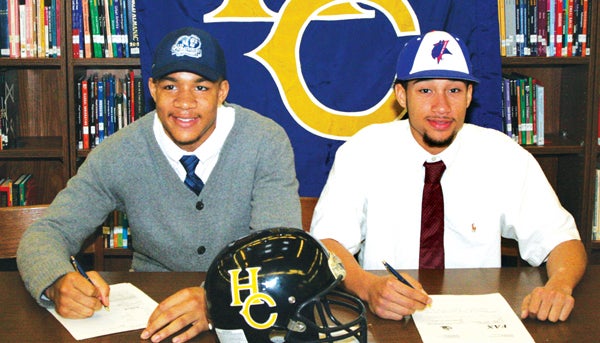 National Signing Day produced a pair of Hertford County High football players inking their Letters-Of-Intent. O’Shane Ximines (left) has signed with Old Dominion University of Conference USA while teammate Ryan Weaver (right) is headed to NCAA Division-II and CIAA member, Elizabeth City State. Staff Photo by Gene Motley