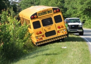 HCPS Bus #197 is shown straddling a ditch following a two-vehicle accident Tuesday morning near the Brantley’s Grove community. Staff Photo by Cal Bryant