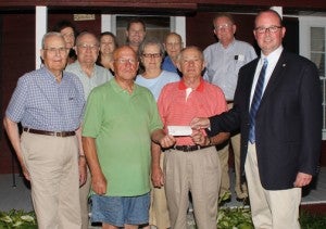 Chowan University’s John Tayloe (front row, right), accepts a check in the amount of $10,000 from Ahoskie Lions Club president JC Doughtie and secretary-treasurer Mack Jones (front center, left and right). Also pictured are Lions Club members David Brinkley (front row, left), Jake Willoughby and Thellis Jones (left and right, middle row), and back row, from left, Y Willoughby, Michelle Jones, Frank Jones, Howard Brown, and Robert Earl Brinkley. Staff Photo by Cal Bryant