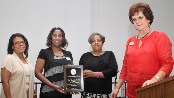 From left, Diana Mitchell, Susan Melton and Sondra Dickens represent The Roanoke Center as they accept the Corporate Business of the Year Award from Judy Collier (right) at last week’s annual meeting conducted by the Northampton County Chamber of Commerce. Staff Photo by Cal Bryant