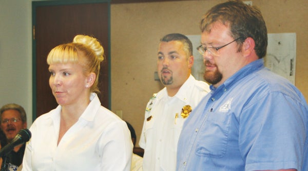 Bertie County Emergency Services Director Mitch Cooper (right) and county EMS Division Chief Matt Leicester (center) introduce Kim Campbell (left) as the county’s new non-emergency transport coordinator during the county commissioner’s monthly meeting on Monday in Windsor. Staff Photo by Gene Motley
