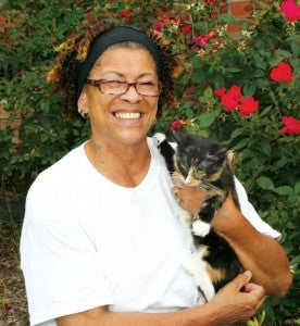 Cathy James poses with “Sipsy”, a homeless cat she rescued in Hertford County.  James founded the Community Cat Advocacy Team (ComCAT) several years ago in the Roanoke-Chowan with hopes of educating about the area’s feral and stray cats. Staff Photo by Gene Motley