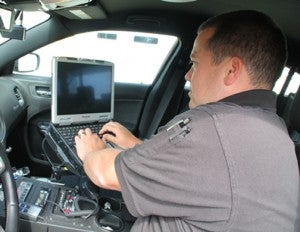 Aulander Police Officer Justin Farmer is shown using the new technology. Staff Photo by Cal Bryant   