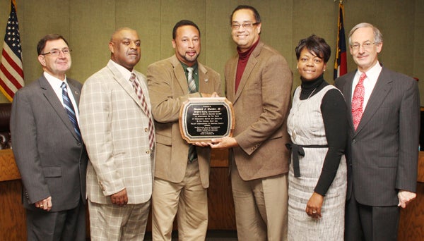 Outgoing Hertford County Commissioner Howard Hunter III (third from left) accepts a plaque of appreciation from Board chairman Bill Mitchell. Others taking part in the Monday night farewell were, from left, Commissioners Johnnie Ray Farmer and Ronald Gatling, County Manager Loria Williams and County Attorney Chuck Revelle. Staff Photo by Cal Bryant