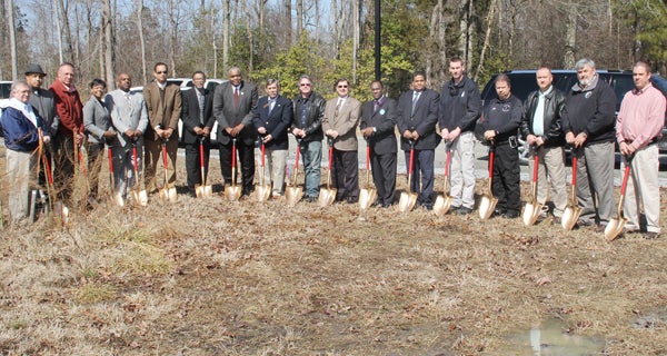 Hertford County officials are joined by those representing the towns of Ahoskie and Murfreesboro to formally break ground on a new E911 and Emergency Operations Center to be constructed behind the new Hertford County Courthouse near Winton. Staff Photo by Cal Bryant
