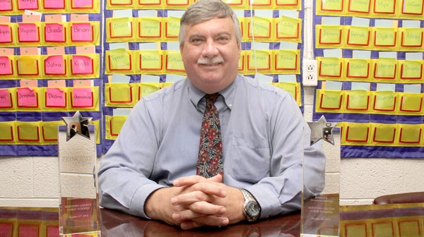 Stan Warren poses with his two Principal of the Year awards for 2014 and 2015. The Murfreesboro native serves as Principal at Ahoskie Elementary School. Staff Photo by Cal Bryant