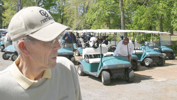 Jim Garrison wore multiple hats during his 50-plus years of service to Chowan University. He is shown here in a photo taken at a fundraising golf tournament at Beechwood Country Club he staged every year for Chowan. File Photo by Cal Bryant