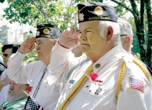 Two members of Hertford County American Legion Post 102 salute the flag at Monday’s Memorial Day service in downtown Ahoskie. Staff Photo by Gene Motley