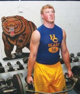 Ian New lifts weights in the shadow of the school mascot at the Hertford County High School weight room.  New, a two-way lineman for the Bears, has been invited to the Blue-Grey Regional Combine in Richmond to workout before college coaches. Staff Photo by Gene Motley