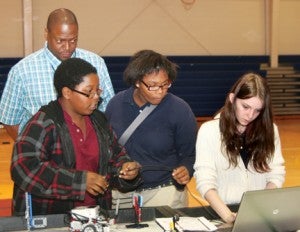 Darrell Walker carefully studies his Bertie Middle School STEM students during a practice for last winter’s Robotics competition held at Roanoke-Chowan Community College. Staff Photo by Gene Motley