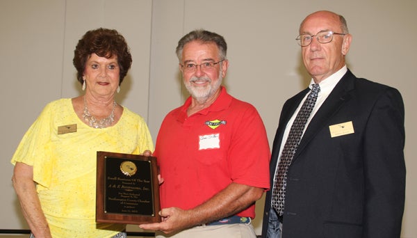 Gene St. Clair (center), was honored as the Small Business Owner of the Year at last week’s Northampton County Chamber of Commerce banquet. Shown making the presentation are Chamber Executive Director Judy Collier and Chamber President Sidney Joyner. Staff Photo by Cal Bryant