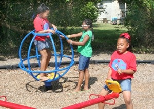 A group of youngsters play at the playground located at Dupont Davis Park near Holloman Ave. and Martin Luther King Drive. Staff Photo by Gene Motley