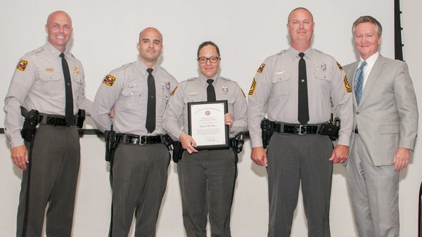 Colonel Bill Grey (left), commander of the North Carolina State Highway Patrol, joins with North Carolina Crime Control and Public Safety Secretary Frank Perry (right) in honoring the Highway Patrol’s Ahoskie office for leading the state in reducing the number of traffic accidents. Representing the local office were (center, from left), Trooper A.S. Genao, Trooper K.R. Genao, and First Sgt. Mike Warren. Contributed Photo