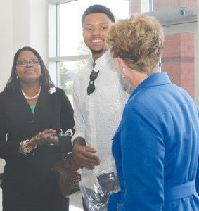 Glynis Bazemore (left) along with her son, NBA player Kent Bazemore (center) greets Gwen Norville, NC Deputy Director of Prisons at the introduction of the Public Safety Cadet Program in Bertie High schools. Staff Photo by Gene Motley