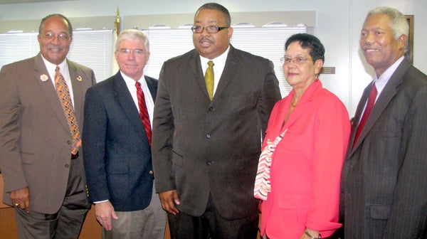 Dr. William T. Wright Jr. (center) is shown with Hertford County School Board members, from left, J. Wendell Hall, David Shields, Shelia Porter and Dennis Deloatch on Thursday just after being selected as the school district’s new superintendent. Staff Photo by Keith Hoggard