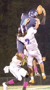 J.J. Miles (in blue) leaps over South Creek defender Zikeyai Cherry (#2) to haul in a pass in Friday’s contest. Miles had a touchdown reception in the game, helping Northampton claim a 32-28 victory.