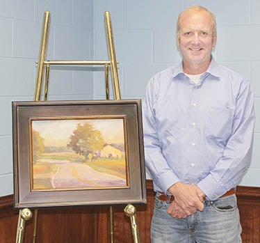 Fen Rascoe is shown here with “Slow Ride,” the painting that he donated to Nansemond-Suffolk Academy for their 31st annual Art Show and Sale. | Contributed Photo