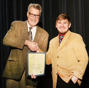 Trevor Marshall (right) of Murfreesboro was among the Chowan University students honored for receiving national recognition for Who’s Who Among Students in American Universities and Colleges. Randy Harrell, Vice President for Enrollment Management and Student Affairs at Chowan University, is shown presenting the award. | Contributed Photo